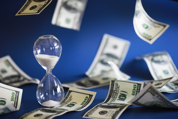 Green dollar bills on a blue background. 100 dollar bills close up. The concept of wealth and success. Money flies in the air.