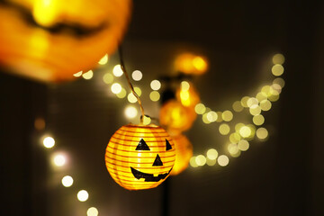 The concept of light on the night Halloween.Round lamp shape of pumpkin used to decorate with bokeh and copy space for text.