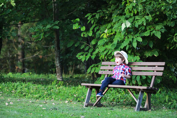Children for a walk in the autumn park. Leaf fall in the park. Family. Fall. Happiness.