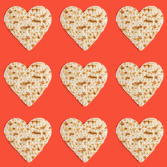 Seamless pattern with matzah in the form of heart for Jewish holiday Pesach on red background.