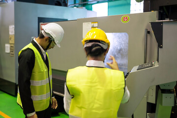 factory audit inspector  discuss at CNC milling robot machine © Blanscape