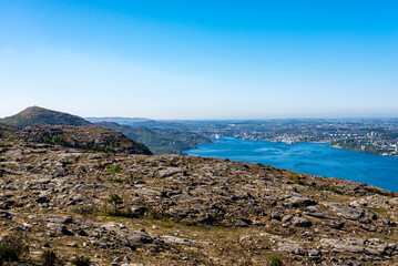 Fototapeta na wymiar A spectacular view from Lifjel mountain top to Gandsfjord fjord and Sandnes town coastline, Norway, May 2018