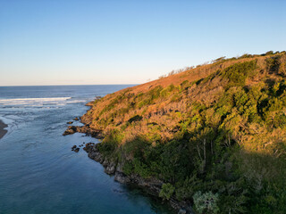 Aerial sunset view of inlet and hills
