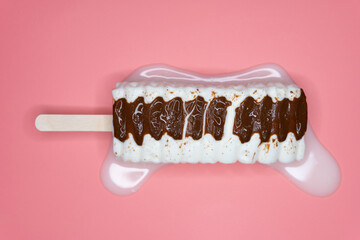 top view vanilla and chocolate flavor popsicle melting on a pink background