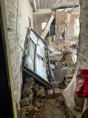 Irpen, Ukraine. May 07. 2022. Destruction from a Russian shell in an apartment building, a broken window and broken walls