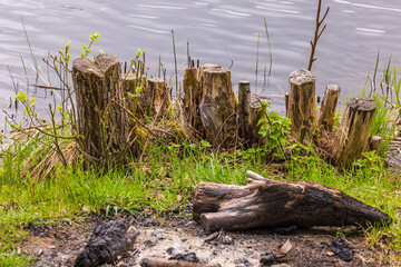 Close up view of campfire site near lake. Sweden.