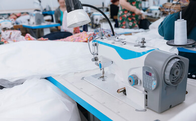 Sewing workshop for disposable gowns for doctors against Covid-19 coronavirus. Concept Interior of garment factory