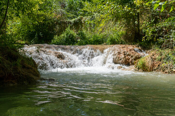 small river waterfall deep in the forest
