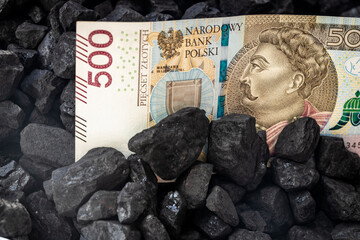 Polish money and coal Concept, coal mining in Poland PLN 500 banknote Rising prices of raw materials in the world Impact on the environment Industry and the country's economy