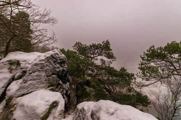 snowy landscape of the Elbsandsteingebirge with bastion bridge (Saxon Switzerland, Germany)