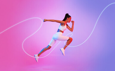 Fototapeta na wymiar Female Runner With Neon Light Line Running In Mid-Air, Studio
