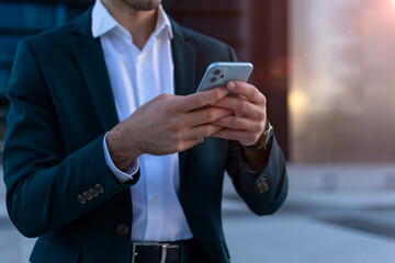 Close up of a man using mobile smart phone

