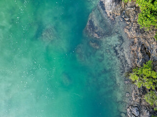 Fototapeta na wymiar Downward aerial view of beach and crystal clear water