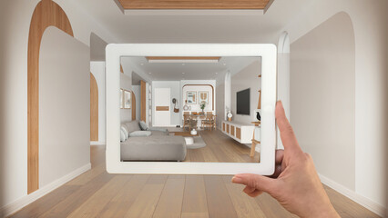 Augmented reality concept. Hand holding tablet with AR application used to simulate furniture and...