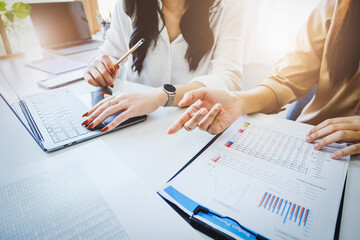 Negotiation, Analysis, Discussion, Portrait of an Asian woman economist and marketer pointing to a financial data sheet to plan investments to prevent risks and losses for the company