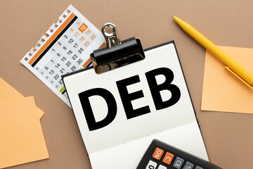 DEB. open clipboard. text on a notepad page. brown background.