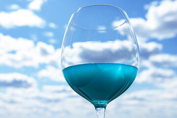 blue drink, summer cocktail at the beach party in a glass, refreshing cold juice