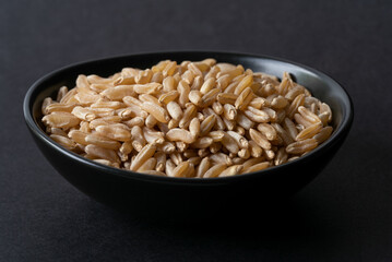 Uncooked Ancient Kamut Grain in a Bowl - 507626228