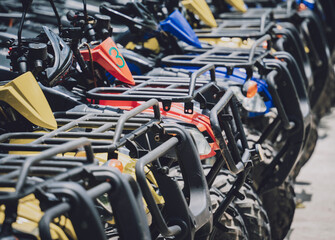 View of row dirty ATVs quad bike