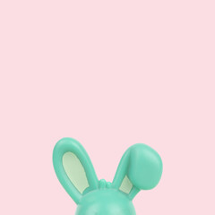 Rabbit bunny ears is hiding on bottom on pink background minimal graphic art. Easter spring concept idea with copy space