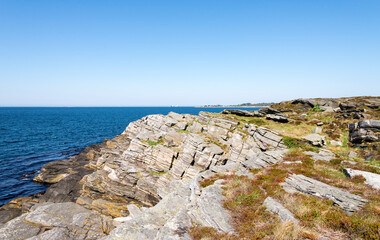 Fototapeta na wymiar Scenic coastal landscape with geological formation layers in Kvernevik suburb, Stavanger, Norway, May 2018
