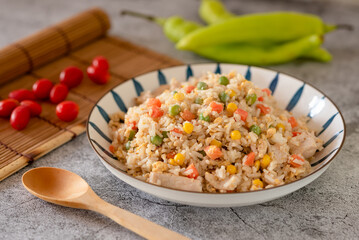 Fried rice with chicken and vegetable on the table