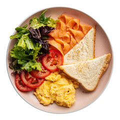 Isolated portion of scrambled eggs with salmon and salad
