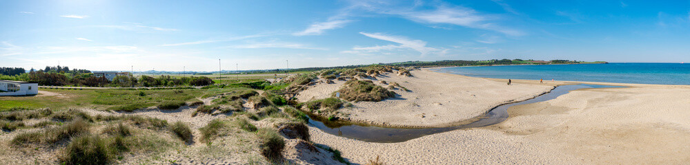 Panorama of Sola beach, sand dunes and a small river entering the sea, Stavanger, Norway, May 2018