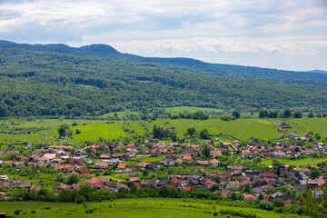 Fototapeta na wymiar Landscape with a Romanian village in summer
