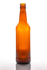 Empty brown beer bottle isolated on white background