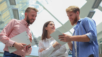 Obraz premium Picture of young designers using tablet in office