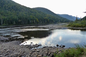 Jacques-Cartier National Park in province of Quebec, Canada, with green foliages, crystal clear...