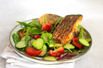 Salad and fried fish
