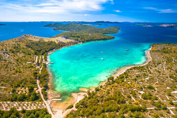 Grebastica turquoise bay and Ostrica historic defence wall ruins aerial view