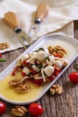 Specially prepared breakfast cheese. A special cheese plate prepared with olive oil, vegetables,...
