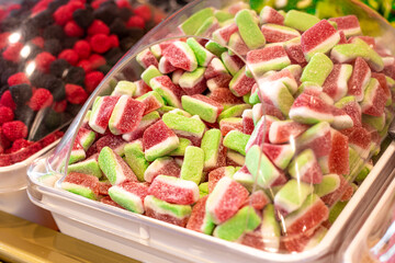 Chewy, jelly sweets on the counter of a candy store.
