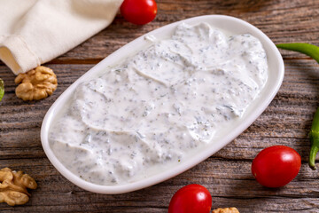 Haydari appetizer. Fresh snack prepared with yogurt and mint. Traditional Turkish cuisine delicacies. Close-up.