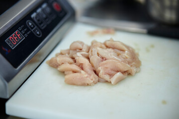 Raw chicken fillet cut into pieces 