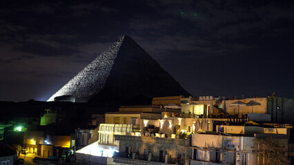 Great pyramids of Giza with sphinx light show view from rooftop at night - obrazy, fototapety, plakaty