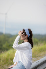 cute girl standing and playing with beautiful nature with clear sky on vacation They stood and took pictures happily.