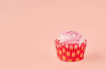 berry muffin in red wrappers on a pink background high-quality photos for calendar and cards. Space for text