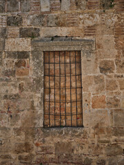 an old window covered with bricks