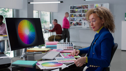 Woman designer study color spectrum and palette working in creative studio