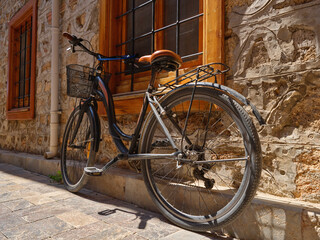 Fototapeta premium an old bicycle parked on the street
