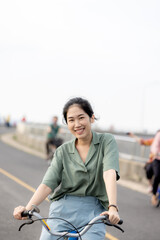 cute girl standing and playing with beautiful nature with clear sky on vacation They stood and took pictures happily.