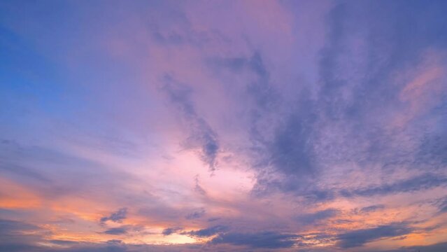 4K Time lapse of colorful sky during beautiful sunset. Romantic clouds. Summer sky
