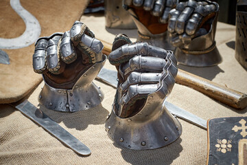 Closeup of steel vintage knight gloves.