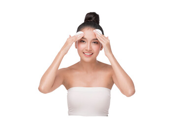 Young Beautiful Asian Woman with Clean Fresh Skin on white background. Beautiful Young Woman Applying Cream using cotton pad. Portrait of beauty face woman natural healthy skin.