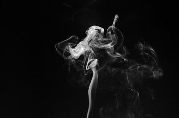 abstract fragment movement of white smoke on black background.