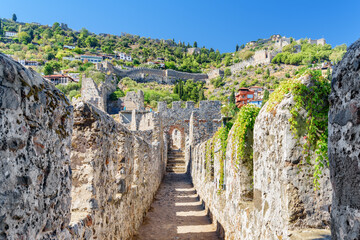Fototapeta na wymiar Scenic walkway along fortress walls of Alanya Castle in Turkey
